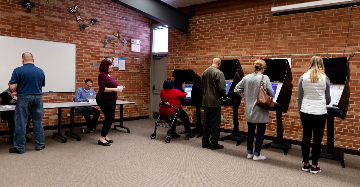 Voters checking in on ExpressPoll and voting on ExpressVote kiosks